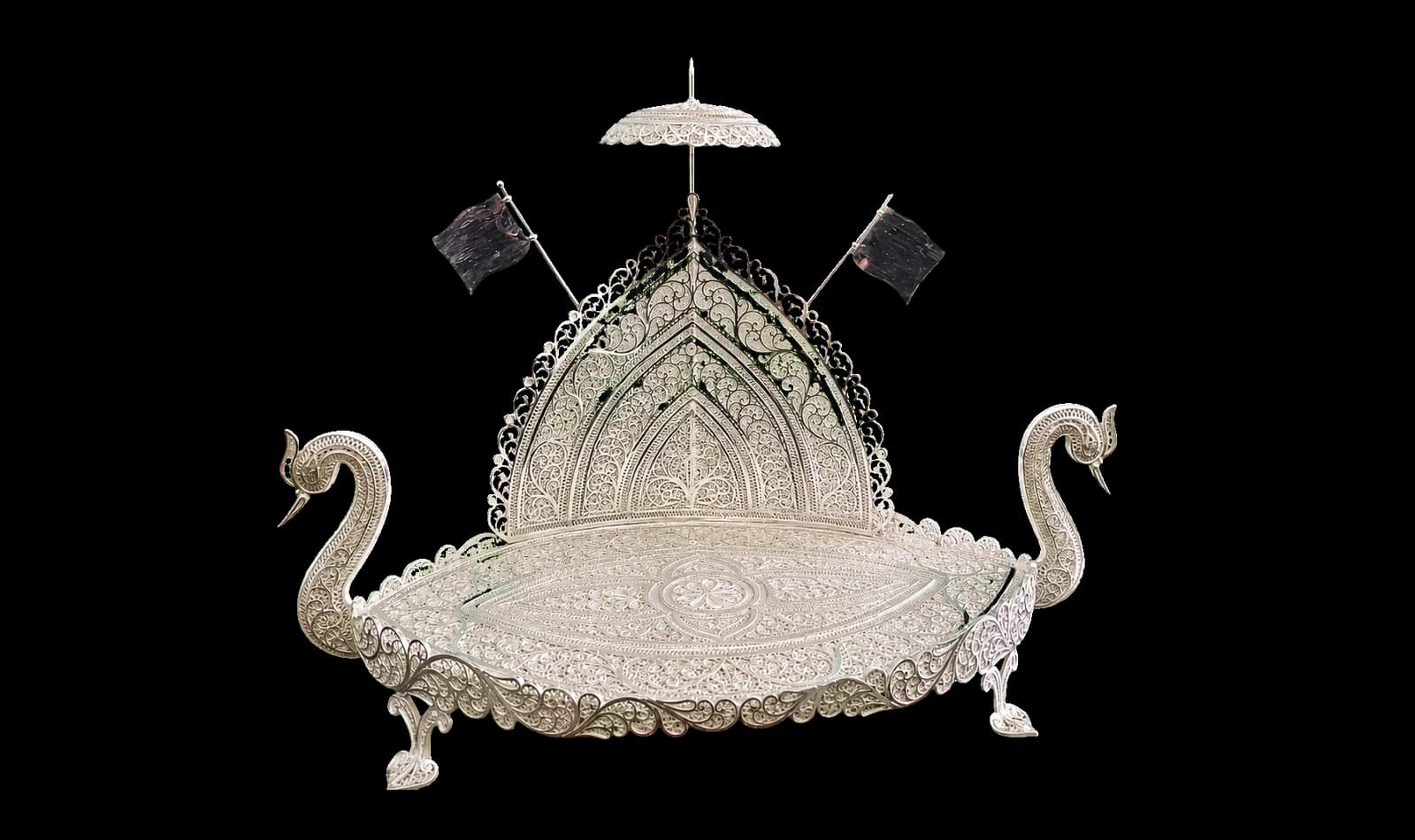 Decorative silver filigree throne with a pair of sculpted swans