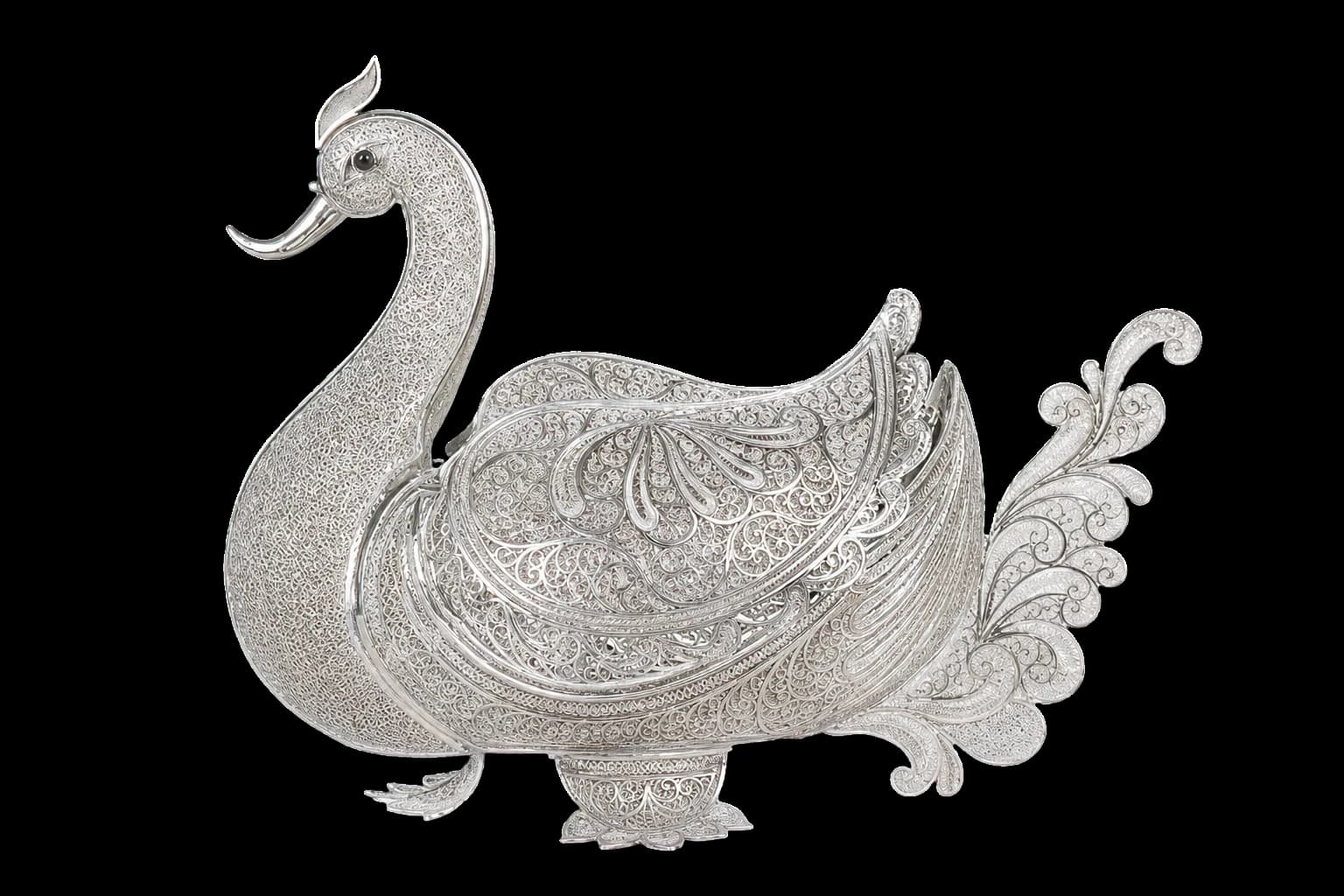 Silver filigree peacock ornament with a sweeping patterned tail