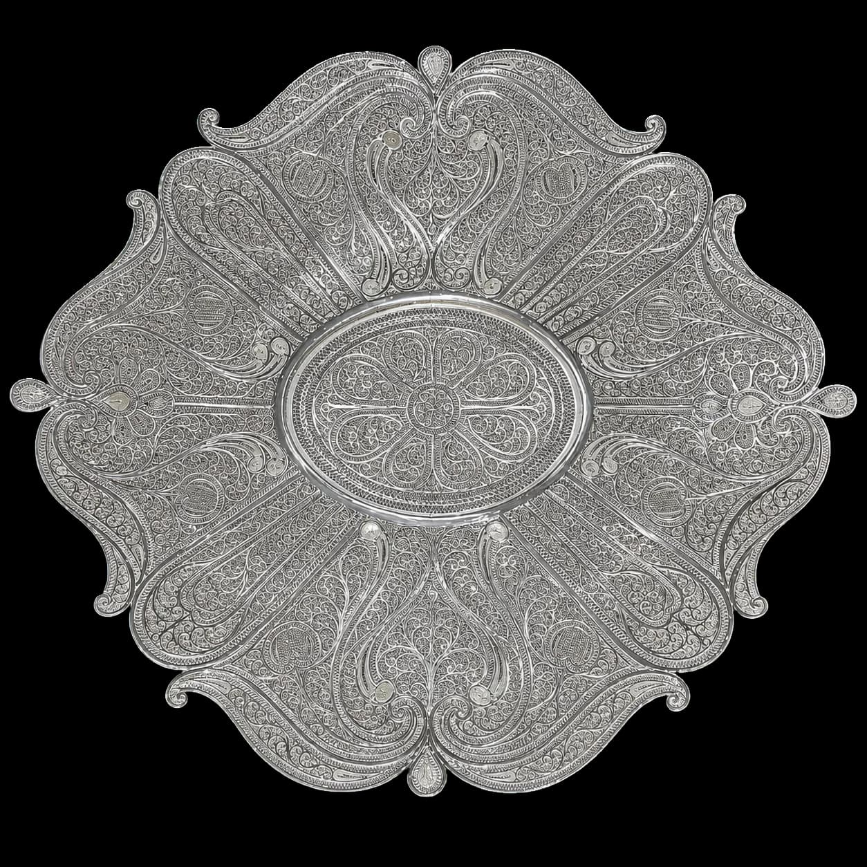 Round silver serving tray with radiating floral filigree