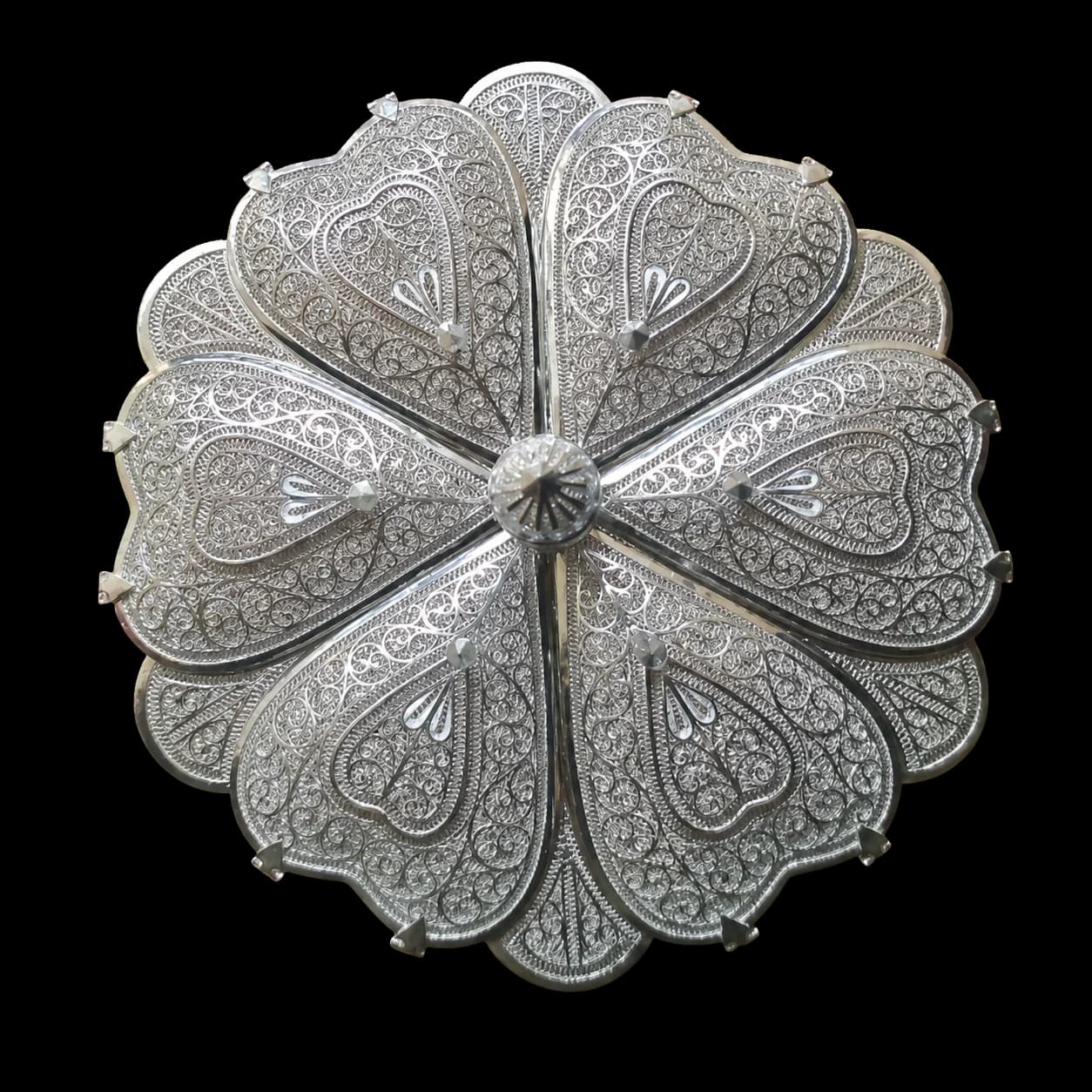 Round silver spice box divided into covered compartments
