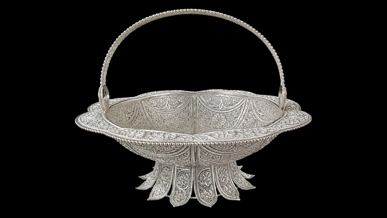 Oval silver filigree basket with an arched handle