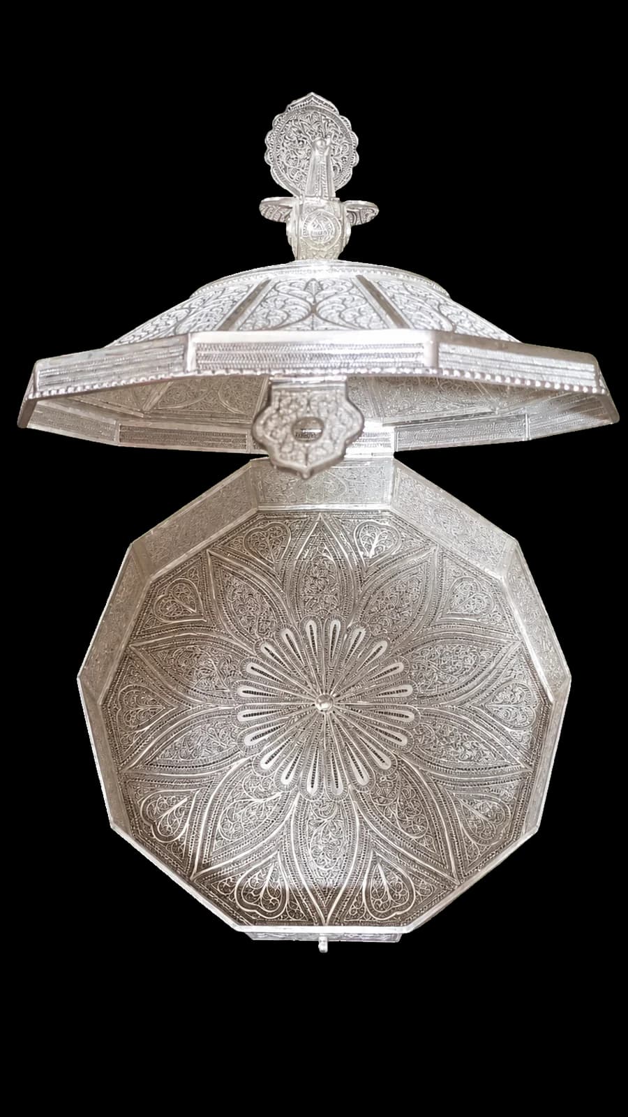 Tall silver filigree perfume bottle with a pointed stopper