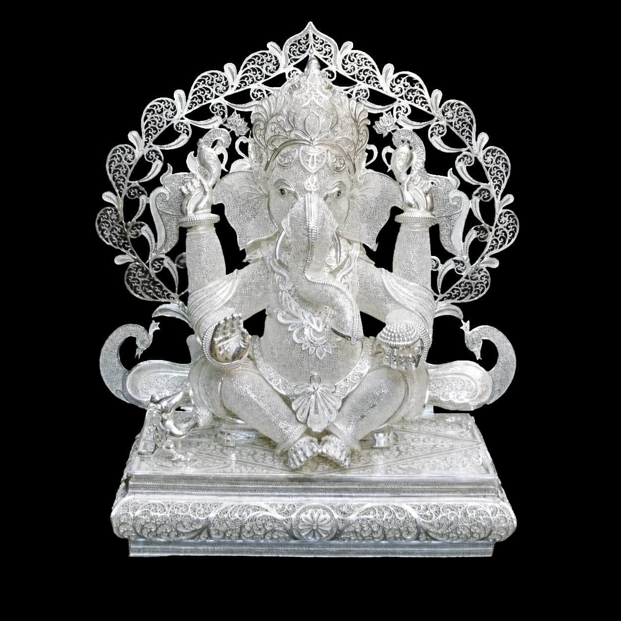 Seated Ganesha sculpture worked in silver filigree